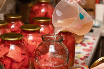 Preparation of homemade canned pickles - salted watermelons in jars