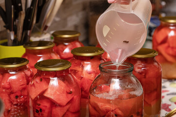 Preparation of homemade canned pickles - salted watermelons in jars