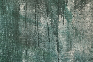 Textured surface with vertical streaks in various shades of green