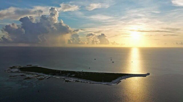Aerial view of tranquil Alacranes Reef at sunset with beautiful clouds and serene ocean, Progreso, Yucatan, Mexico.