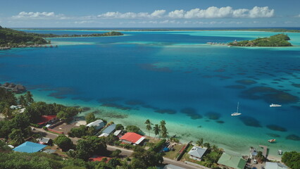 Aerial view of Bora Bora island beach coast, turquoise lagoon bay, green islands resort, buildings...