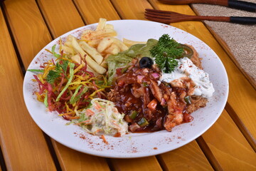 Fried chicken schnitzel cordon bleu with cheese in breadcrumbs is restaurant food. Delicious tender chicken chnitzel with homemade french-fries