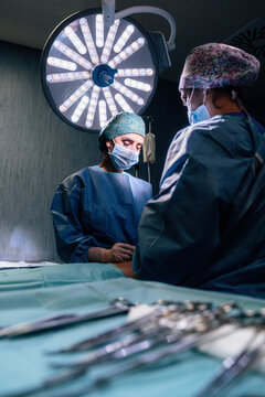 Intense surgical team at work in a modern operating room