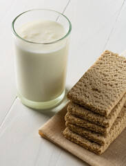 Whole grain diet bread and a glass of yogurt