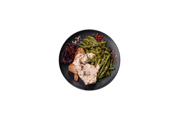 Asian food baked chicken breast with green beans, sesame seeds and sauce