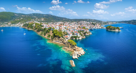Panoramic summer view of the old harbor and town of Skiathos island, Sporades, Greece, with Bourtzi peninsula and Plakes area in front 