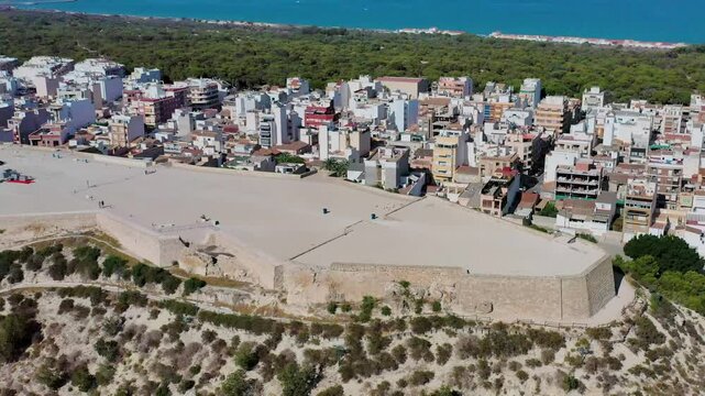 Aerial view of Guardamar Castle overlooking the beautiful coastal town and sea, Guardamar del Segura, Spain.
