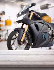 Fototapeta premium Empty motorcycle shop counter table, blurred background, motorcycle shop, copy space. Store with rows of new motorcycles, motorcycle sports store. ideal for displaying advertising products
