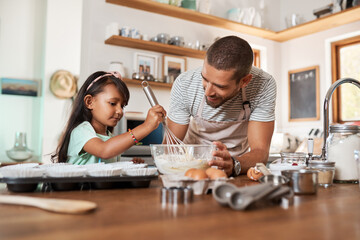 Fototapeta premium Father, child and learning with baking, skill or cooking for nutrition, education and growth. Male person, kid and teaching in youth development, support and bonding on kitchen counter in family home