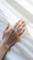 A serene image of a person's hand placed over their chest, symbolizing a heartbeat, with a subtle light color backdrop for tranquility