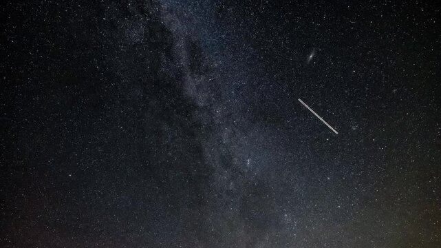 Time lapse footage of the Milky Way and perseid meteor shower with satellites and planes. Galaxy time lapse 4k video.