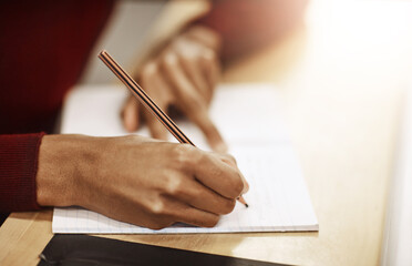 Writing, education and hands of person in university for research, notes and syllabus information....