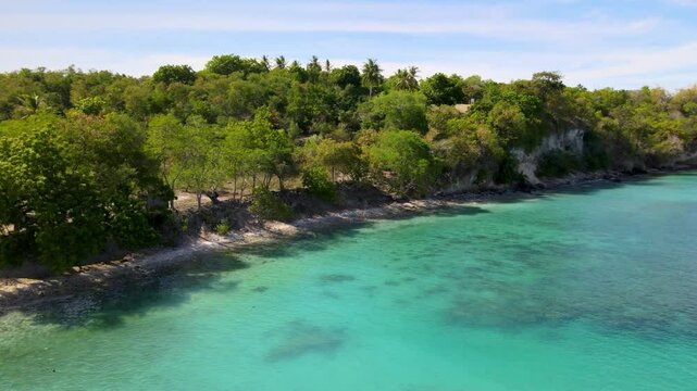 Tranquil Ripples Flowing Near a Cliffside Coast