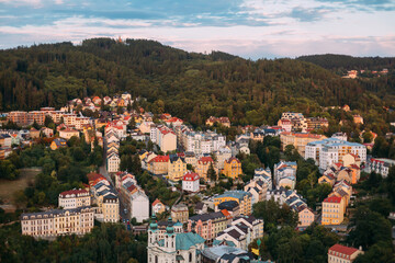 View of Karlovy Vary from the hill. View from the mountain to the small houses of a European town....