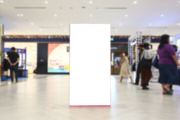 A blank billboard stands in a shopping mall.