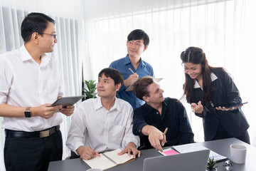 Group of diverse office worker employee working together on strategic business marketing planning in corporate office room. Positive teamwork in business workplace concept. Prudent