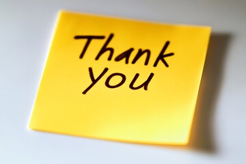 Thank you note expressing gratitude on yellow sticky note