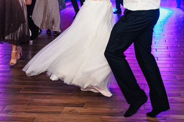 people dancing on the dance floor, party, men and women dancing, New Year's party, wedding party, birthday party , beautiful shapely legs, slender legs of dancers