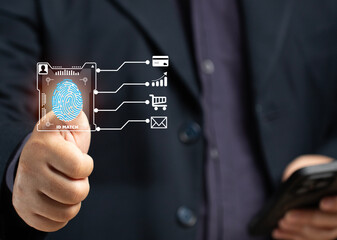 A man scans his fingerprint to verify his identity when making a business transaction on his smartphone, using a credit card online, shopping online, or encrypting the code to verify his email.