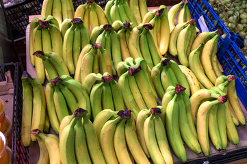 Bananas in a crate on rustic wood table