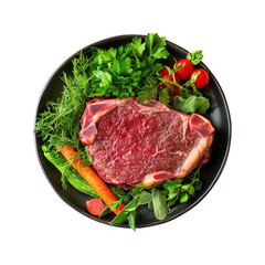 Fototapeta premium Raw Steak with Vegetables on a Black Plate