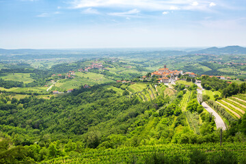 View of the vineyards valley in the Brda area and ancient town of Smartno, Slovenia