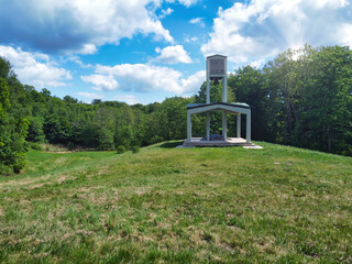 Bell Tower at Skamlingsbanken, Denmark, is a historic structure, grass, and blu sky