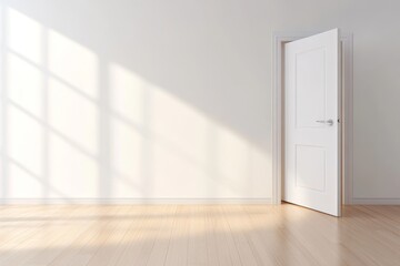 An empty modern living room with a white door ajar, sunlight streaming through a window casting shadows on the white wall and light wooden floor. The room is ready for furniture and decoration, symbol