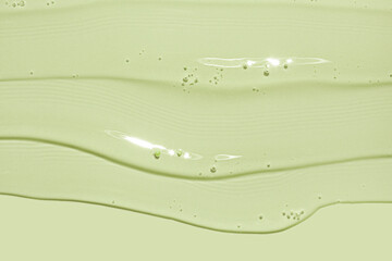 Cream gel apple green transparent cosmetic sample texture with bubbles