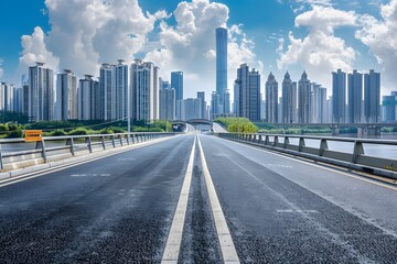 Urban Landscape: A Wide Road Leading to Skyscrapers Under a Bright Sky