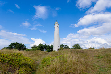 The white lighthouse under blue sky, The south tower (Zuidertoren) or water tower, Schiermonnikoog is a municipality and national park in the Northern Netherlands and one of the West Frisian Islands.