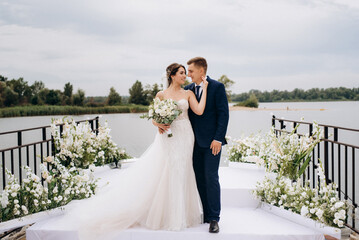 bride and groom against the backdrop of a yellow sunset
