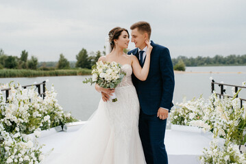 bride and groom against the backdrop of a yellow sunset