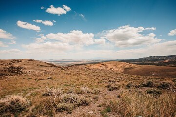 Traveling through a desert landscape under a clear blue sky