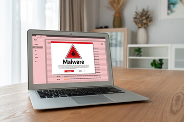 Cyber attacking concept. Malware alert showing on computer screen display scam and threat detection on computer system or online server to be removed snugly.