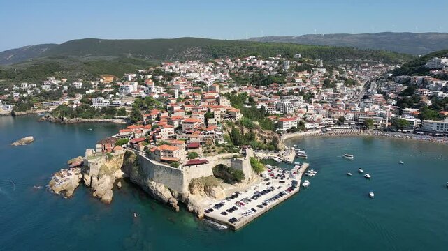 A drone flies around the Old Town in Ulcinj on a sunny summer day