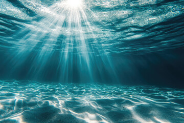Beneath surface, soft light rays illuminate tranquil underwater scene
