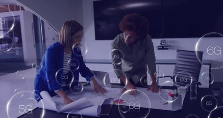 Animation of 6g text over diverse colleagues discussing work in office - Powered by Adobe
