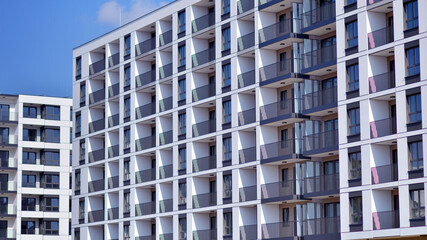 Fototapeta premium Modern architecture of urban residential apartment building. Apartment building exterior, residential house facade.