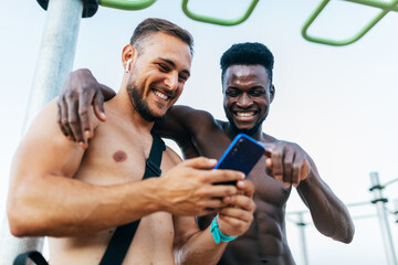 Two friends enjoying a calisthenics workout together