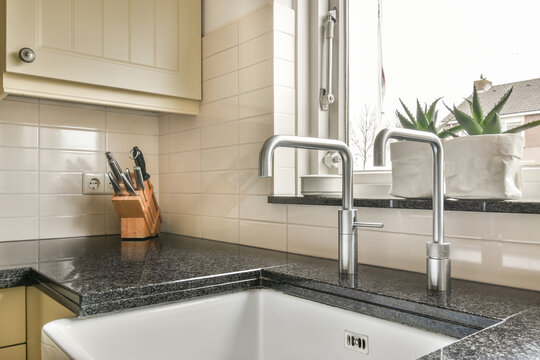 Modern kitchen sink with stainless steel faucet