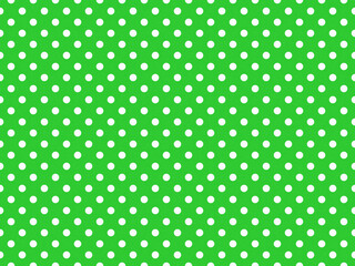 texturised white color polka dots over lime green background