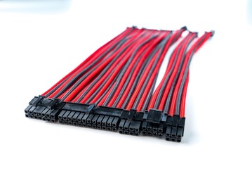 A close-up image of a black and red computer cable on a white background. This durable cable is...