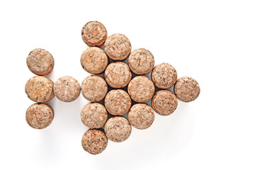 champagne wine corks arranged in the shape of an arrow pointing to the right isolated on a white background