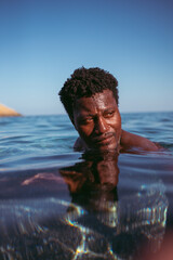 person in the water in Folegandros, Greece