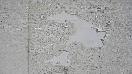 White peeling paint surface on a wooden substrate