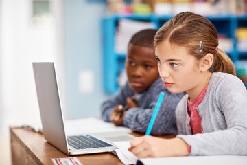 Laptop, notes and school kids in classroom together with project for growth, child development or teamwork. Diversity, learning and students with online course for education, exam and writing at desk