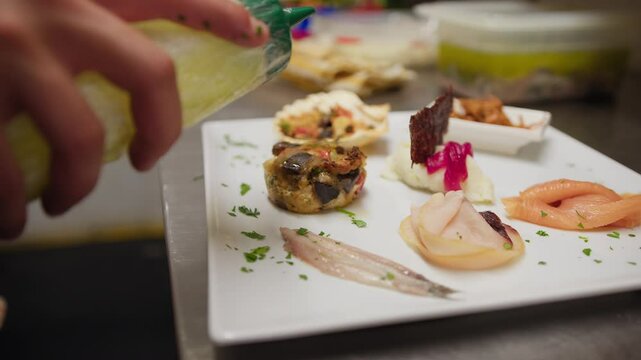 Plating Of A Raw And Cooked Fish Based Appetizer In A Luxury Italian Kitchen