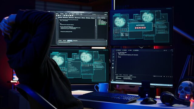 Hacker receiving access denied error message after being contracted by company in secret to do corporate espionage and steal information on competitor products to gain marketplace advantage, camera B