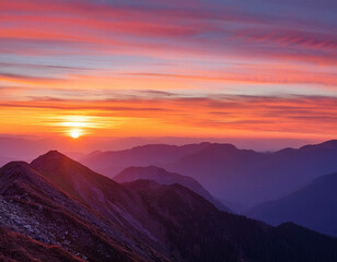 Obraz premium A breathtaking view of a mountain range at sunset, with the sky painted in shades of orange,